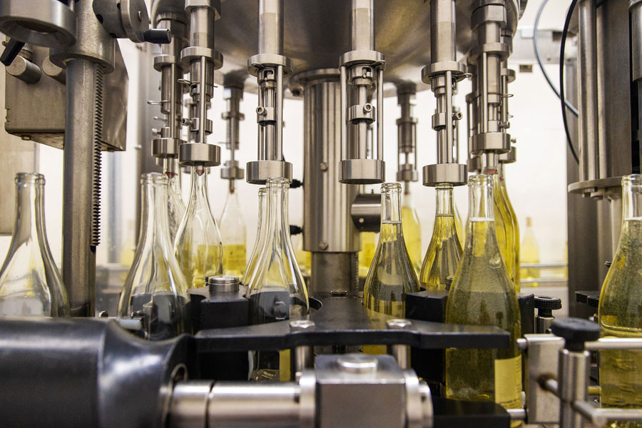 White wine bottle production at wine processing plant
